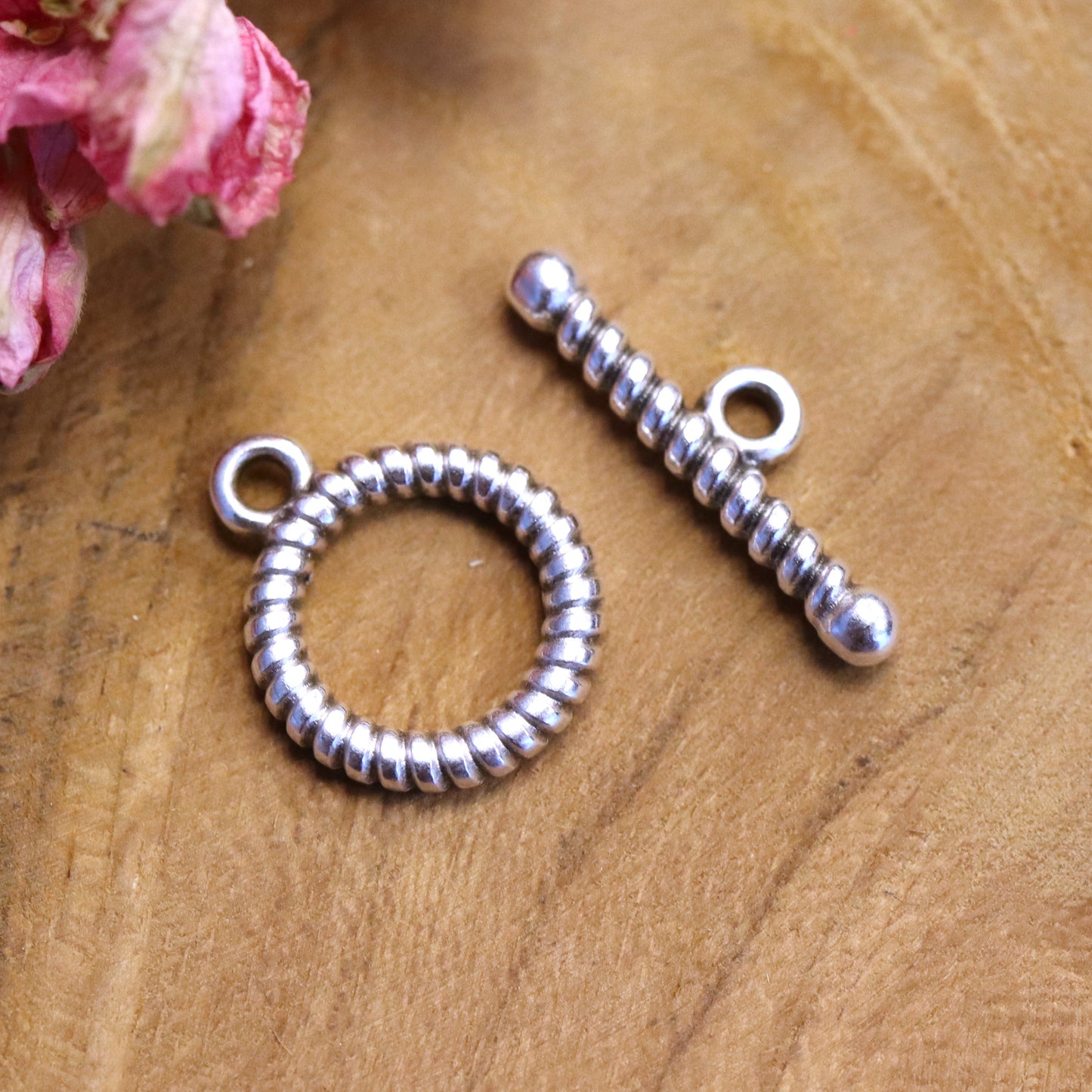 Gedraaid kapitel slot DQ zilver