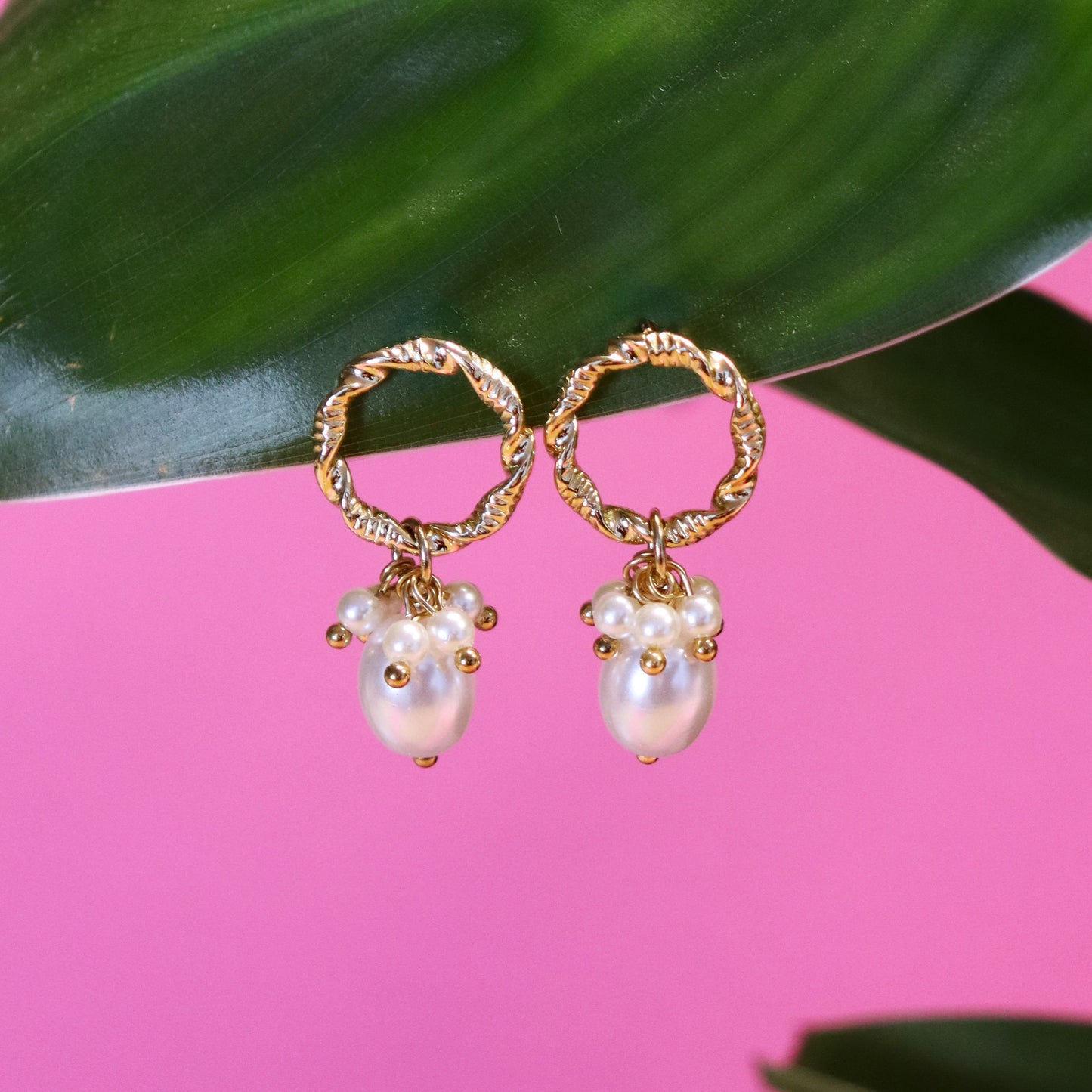 Stainless steel stud earrings with gold pearls