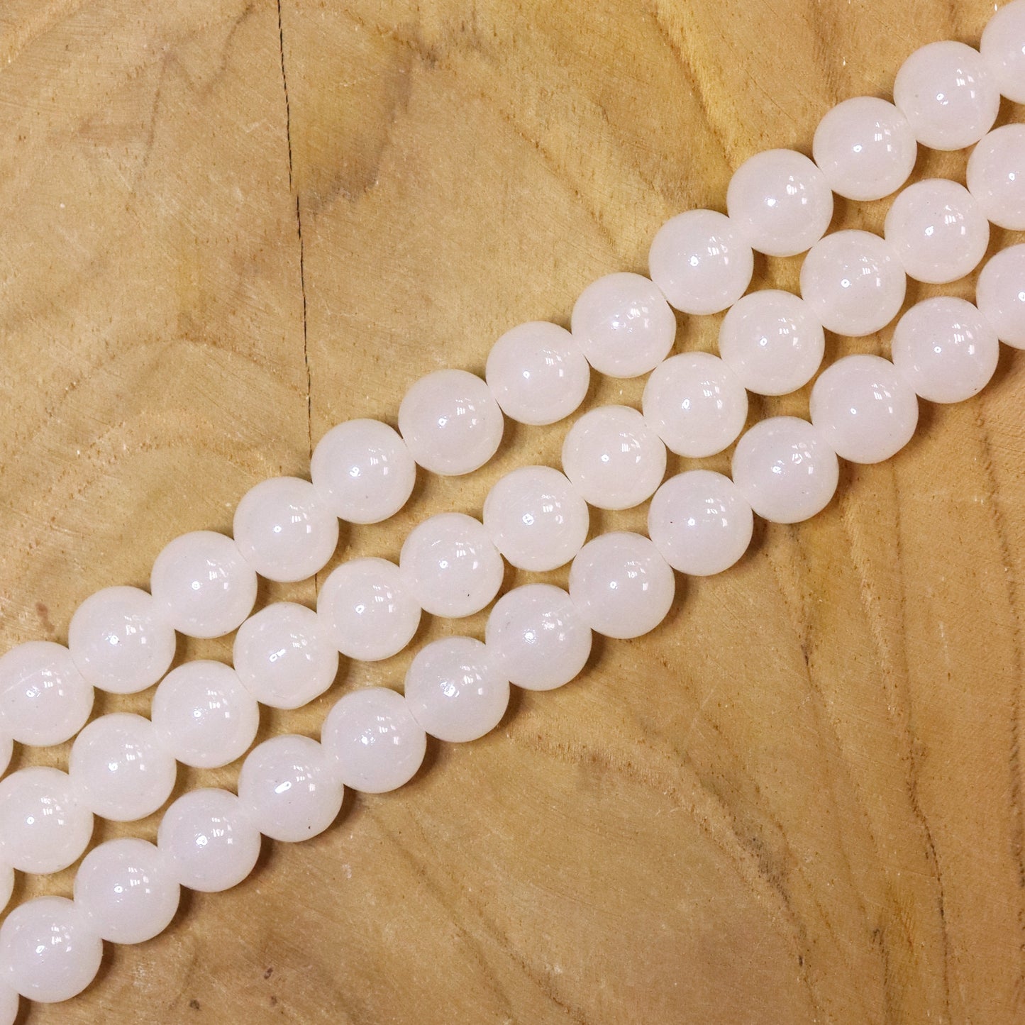 Colored glass beads per strand - cream