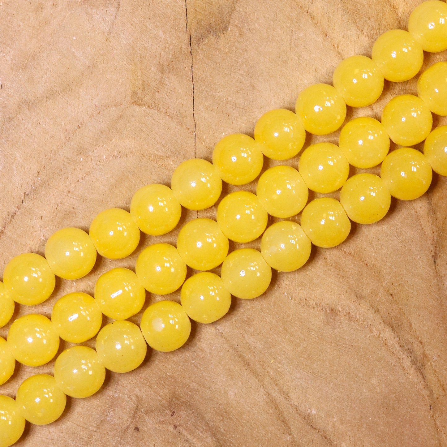 Farbige Glasperlen pro Strang - gelb