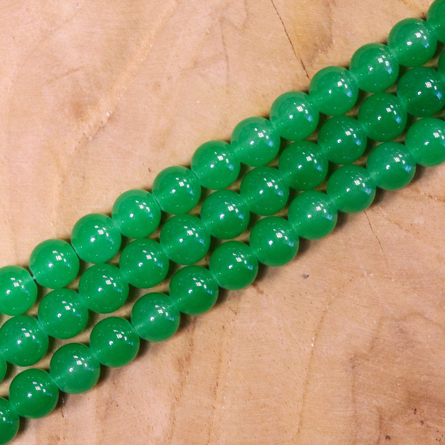 Gekleurde glaskralen per streng - groen