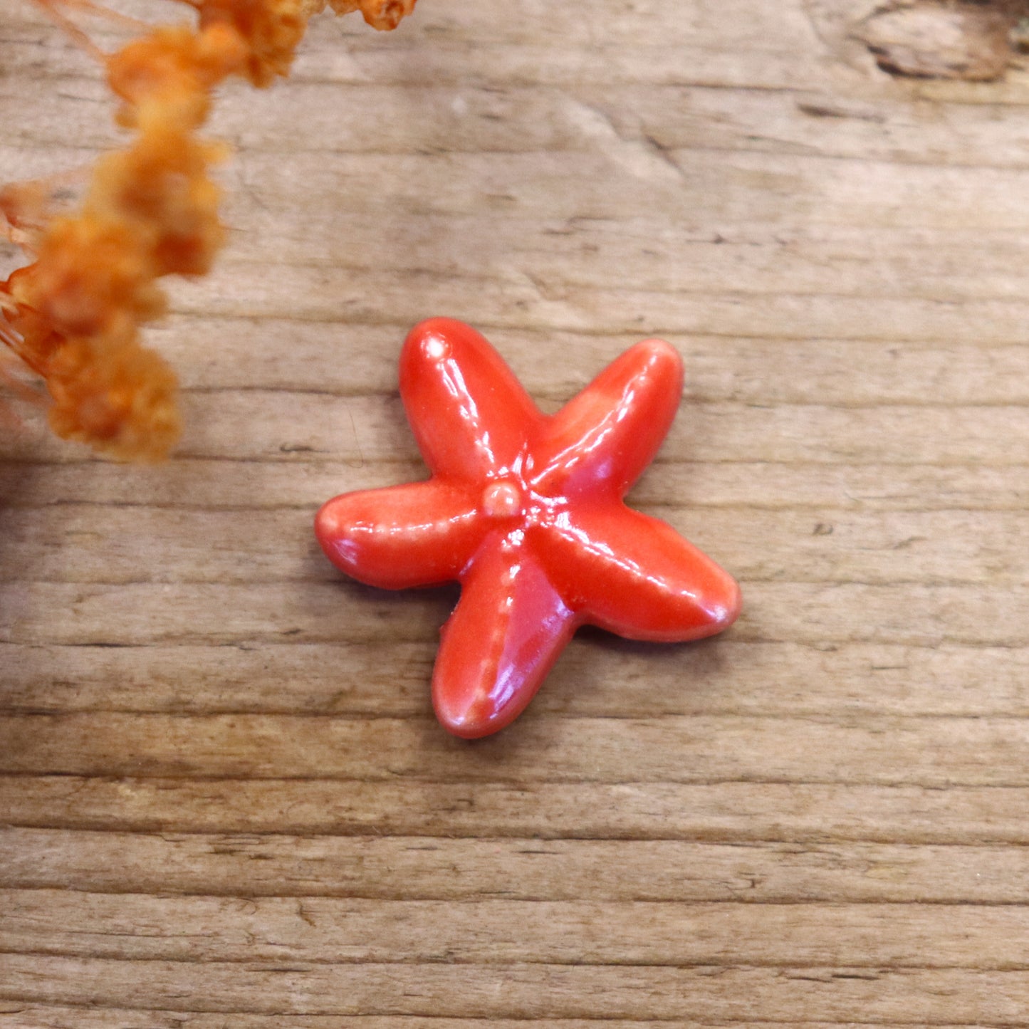 Bead red - ceramic starfish