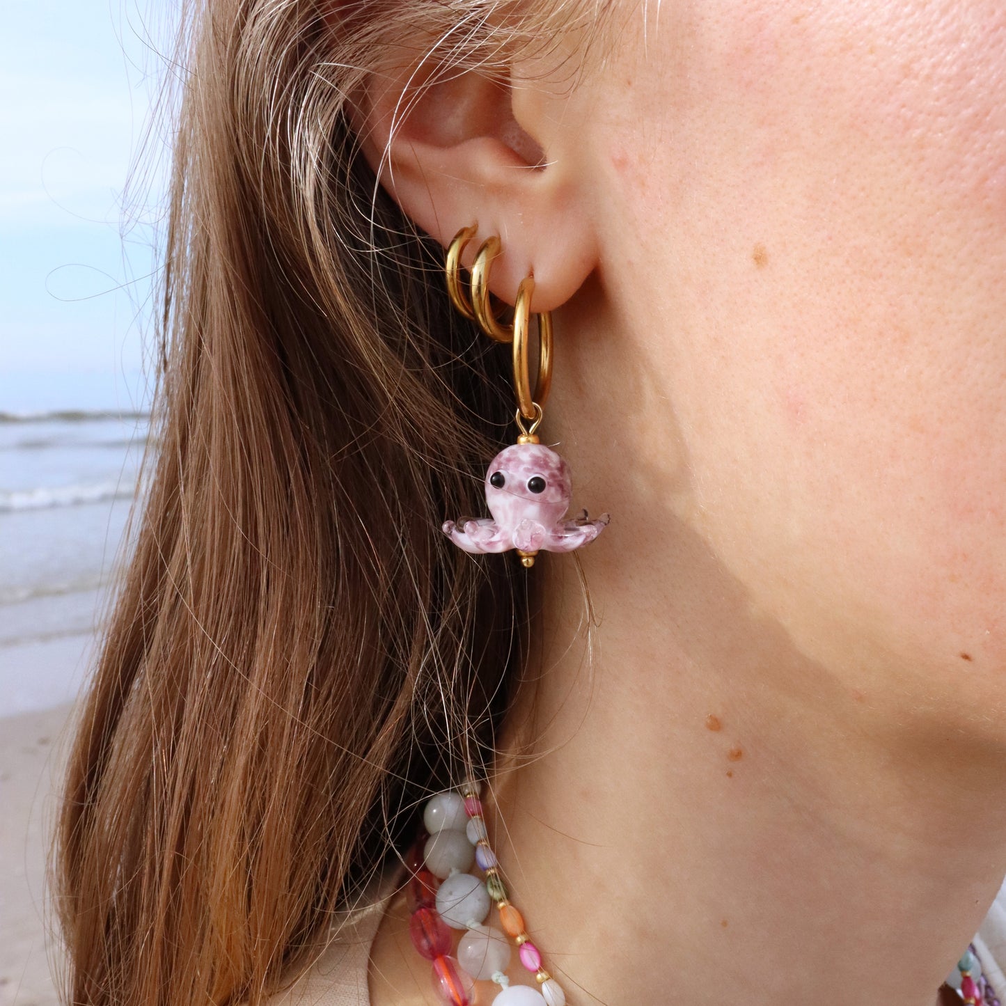 Stainless steel earrings with a little squid.