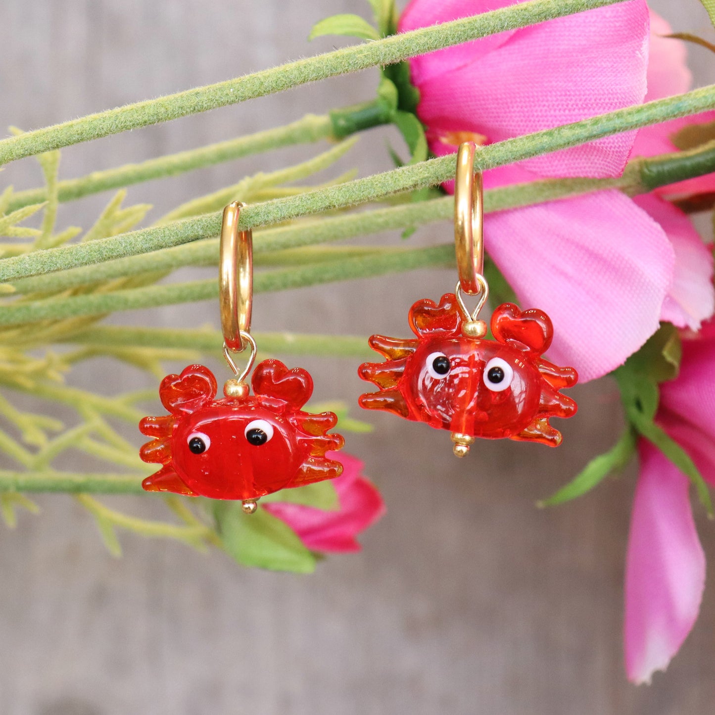 Stainless steel earrings with crab design.