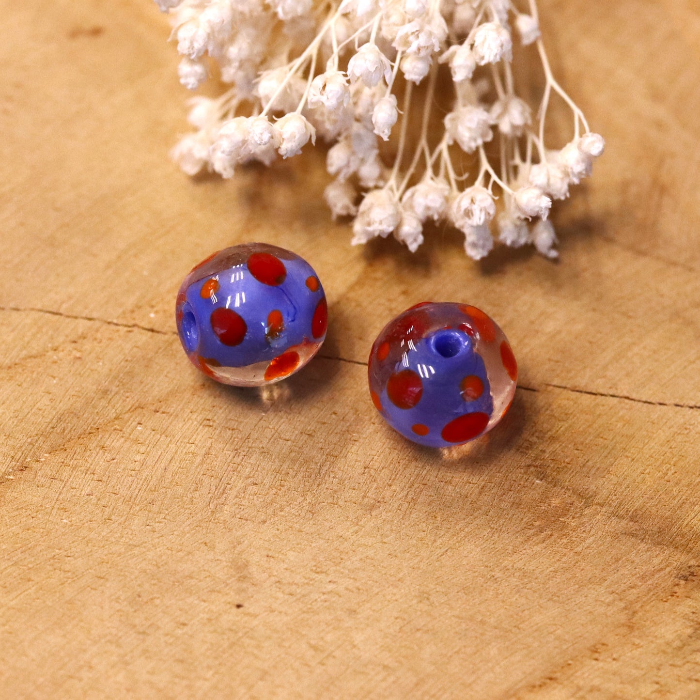 Blue bead - glass bead with red dots