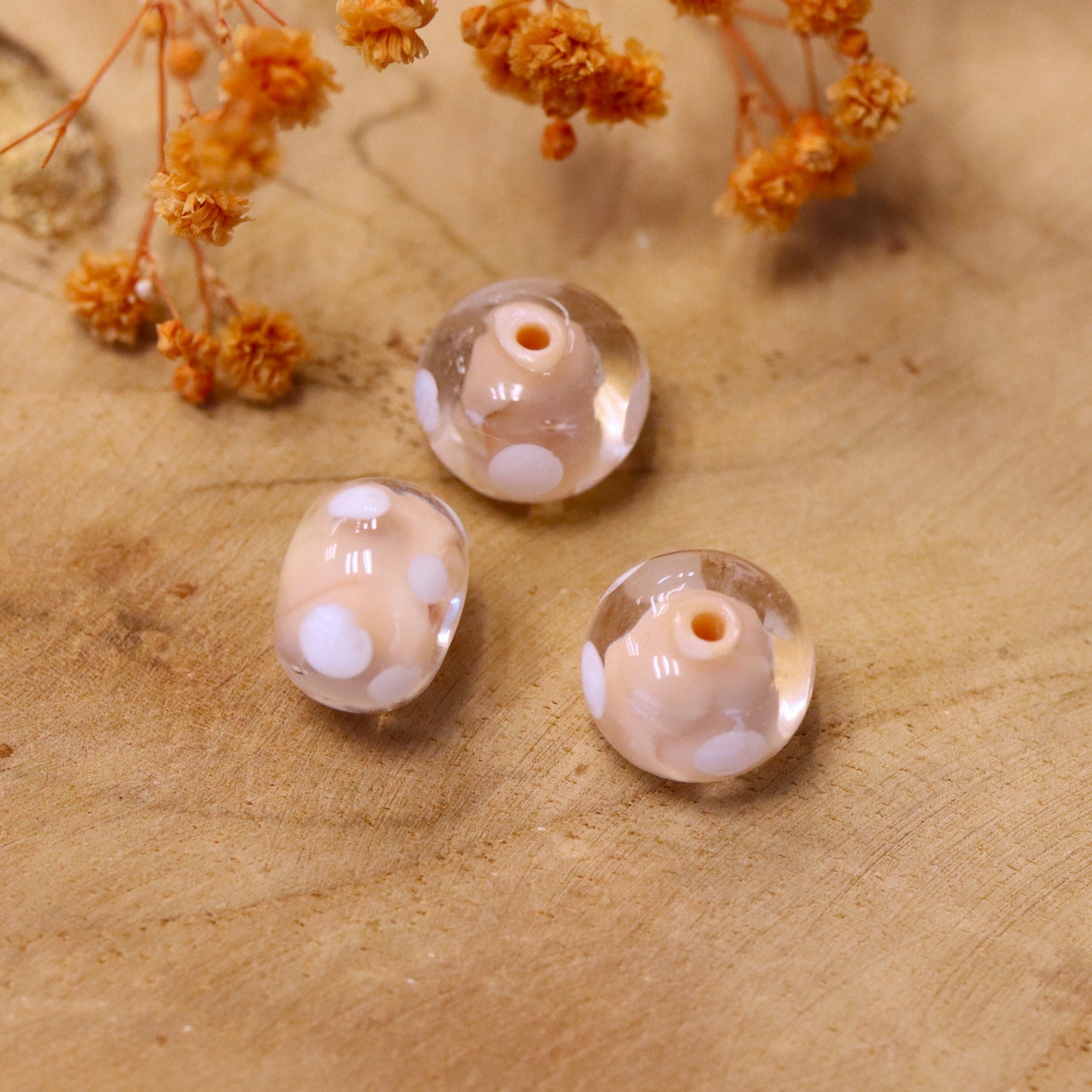 Beige beige - glass bead oval with white dots