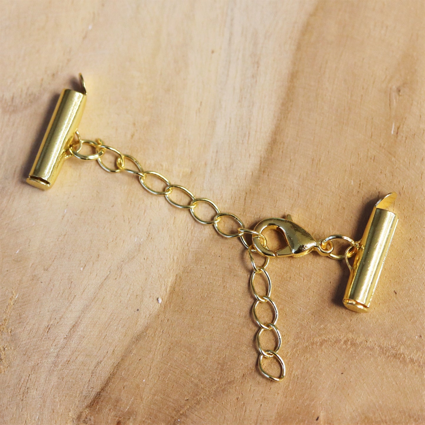 Eindkap sluiting met verlengketting 15mm goud