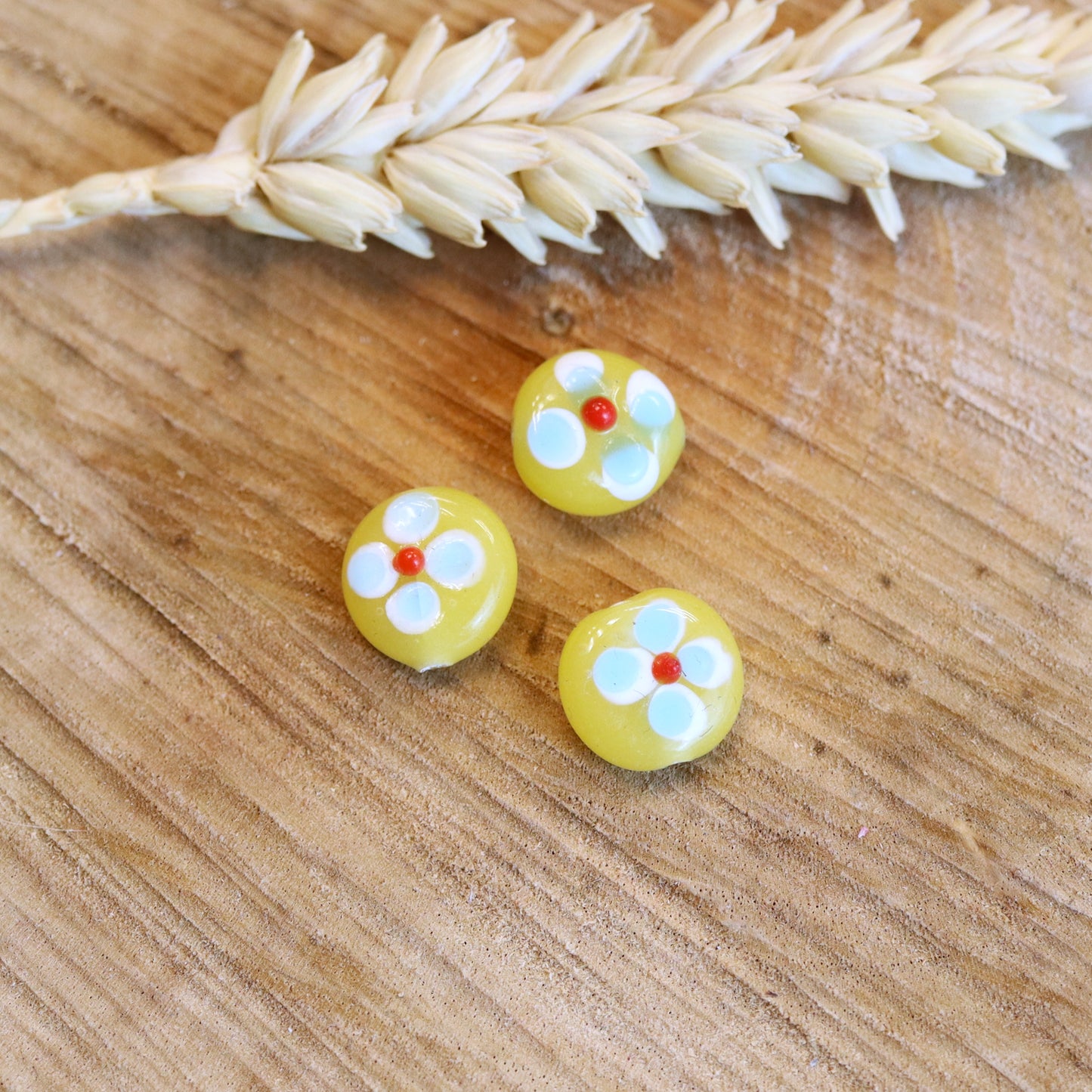 Bead yellow - ceramic with blue flower