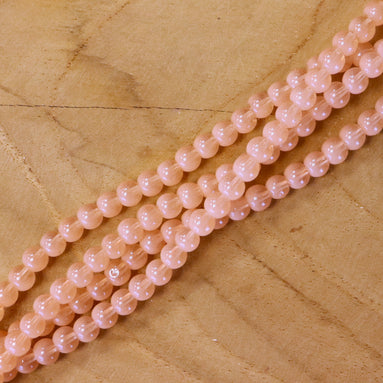 Cat eye glaskralen per streng - light salmon