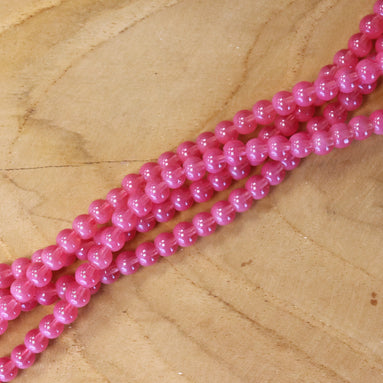 Cat eye glaskralen per streng - roze