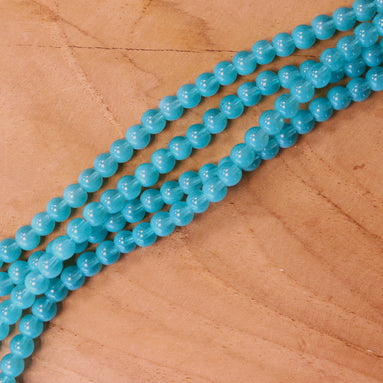 Cat eye glaskralen per streng - turquoise