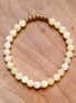 Armband kralen lichtgeel met goud