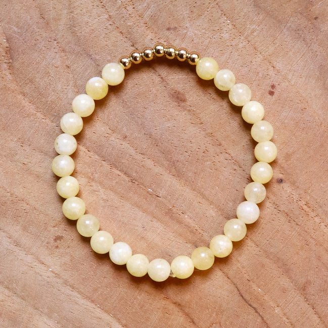 Armband kralen lichtgeel met goud
