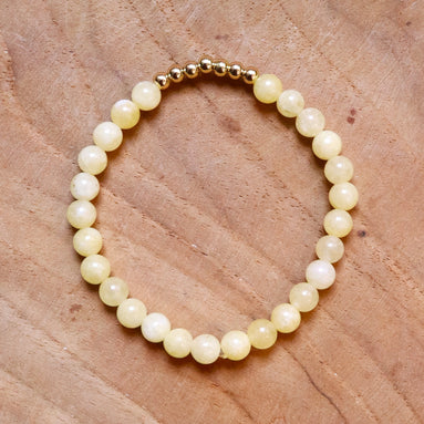 Armband kralen lichtgeel met goud