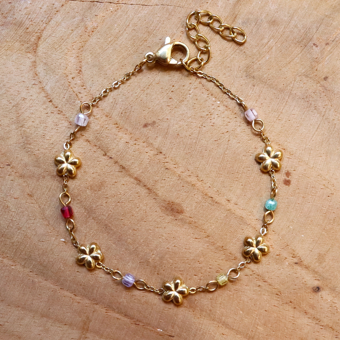 Stainless steel armband bloemetjes en kralen goud