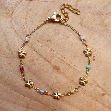 Stainless steel armband bloemetjes en kralen goud