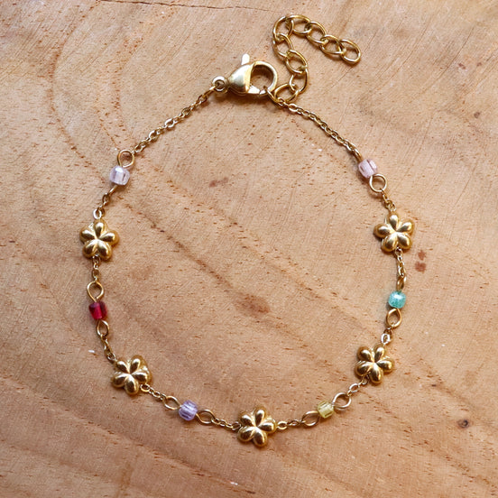 Stainless steel armband bloemetjes en kralen goud