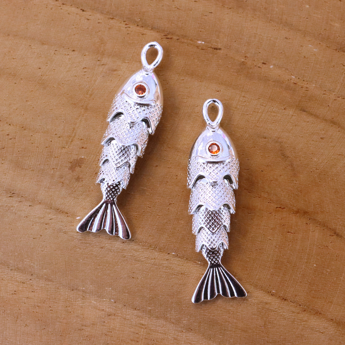 Brass pendant - fish with a stone
