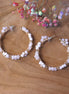 Statement oorbellen goud - oorringen met facetbloemen wit