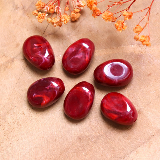 Acrylperle unregelmäßig oval bordeauxrot