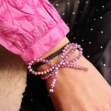 Facet armband met strik - roze