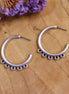 DQ silver stud earring with four eyes large