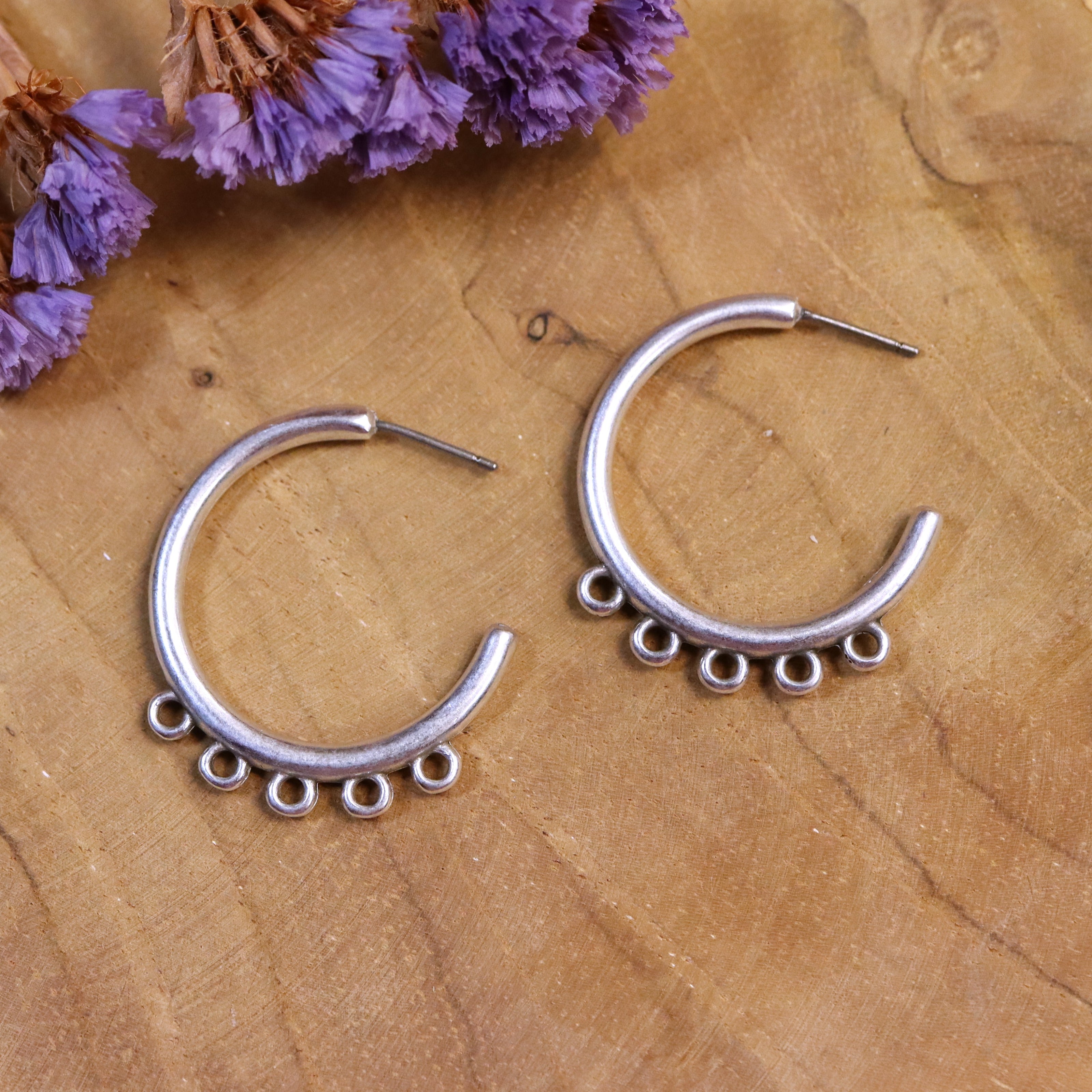 DQ silver stud earring with four eyes large