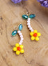 Charm bead flower - orange with green leaves