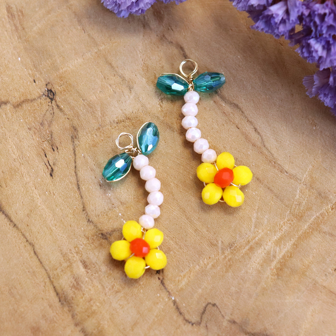 Charm bead flower - orange with green leaves