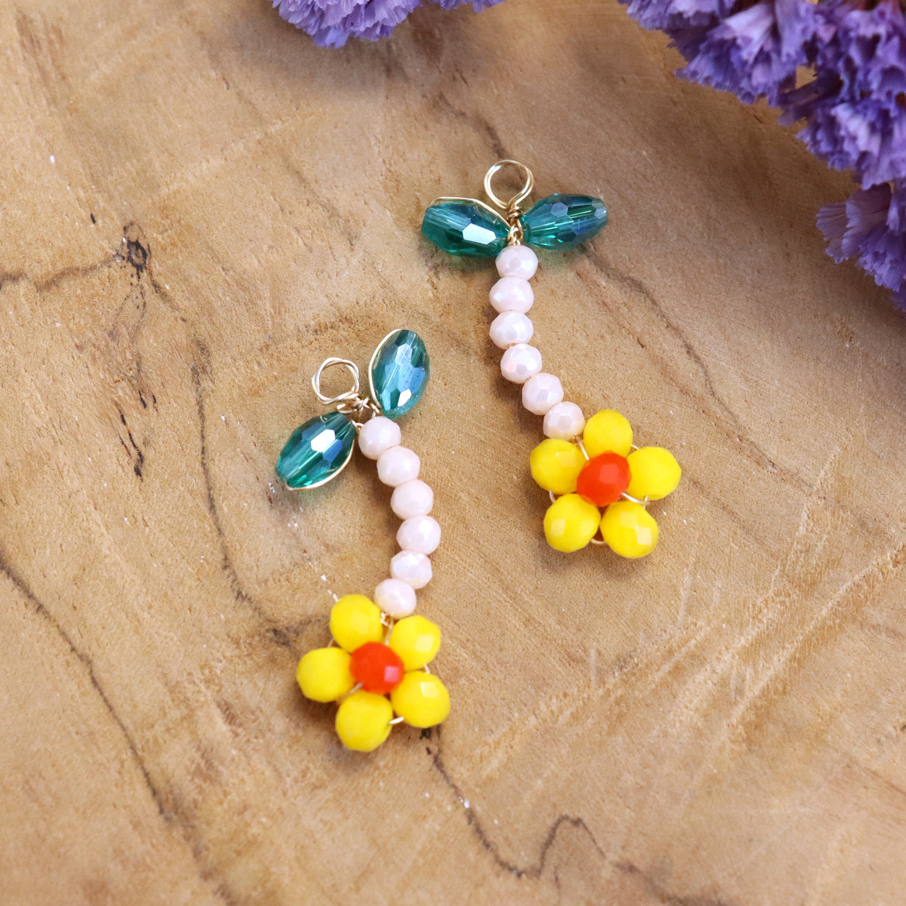 Charm bead flower - orange with green leaves