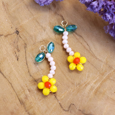 Charm bead flower - orange with green leaves