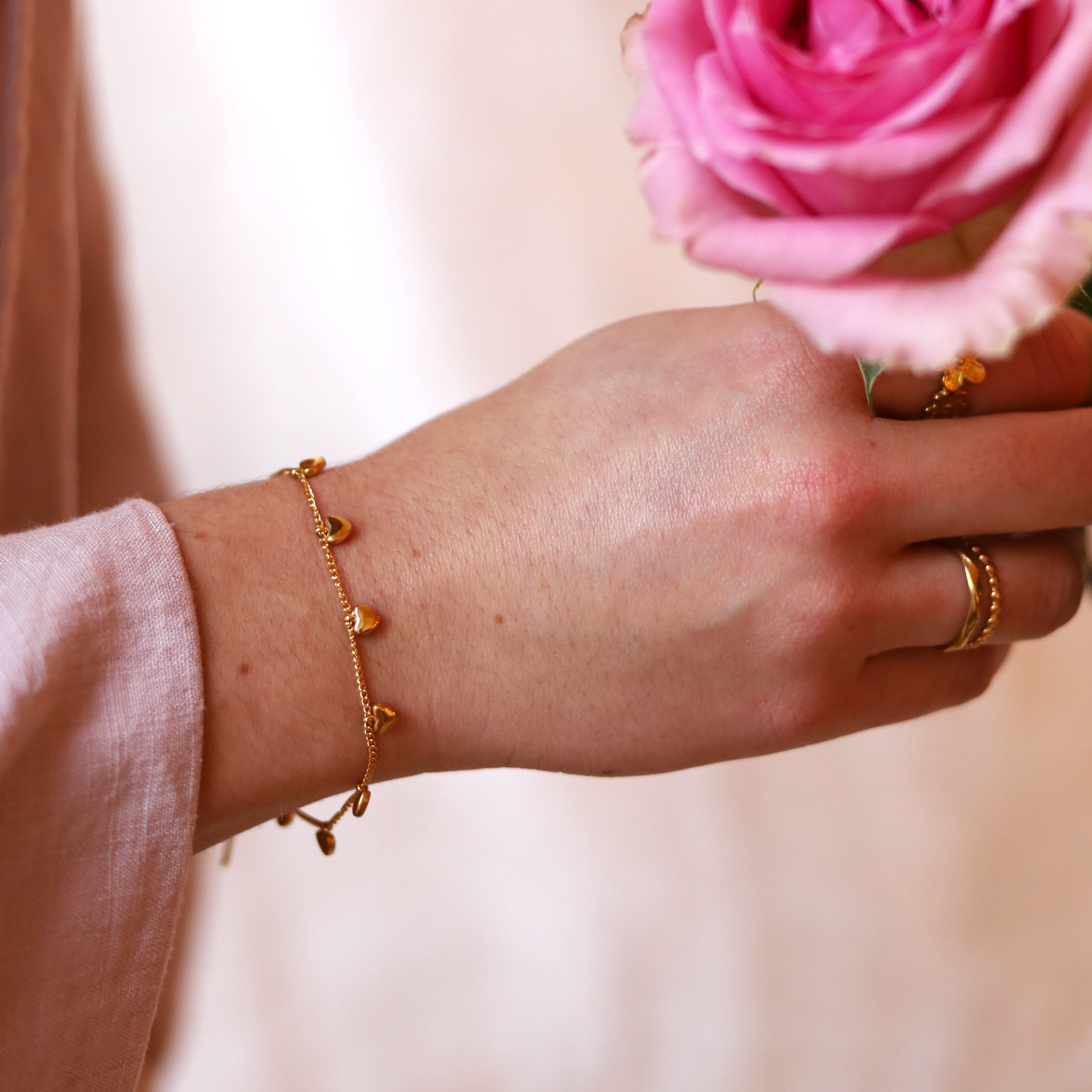 Stainless steel bracelet - with small heart charms