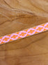 Ribbon flower orange-pink with gold edge