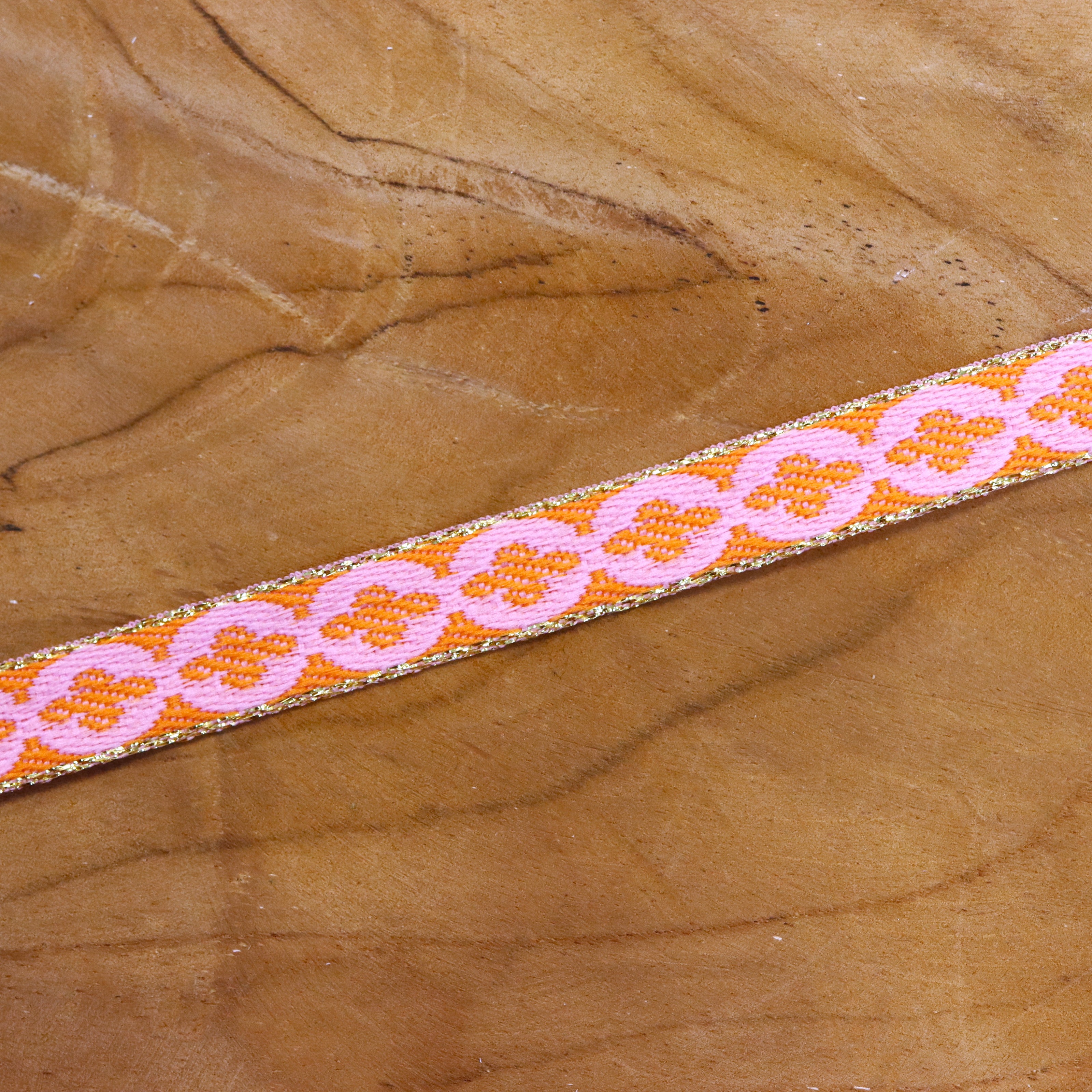 Ribbon flower orange-pink with gold edge