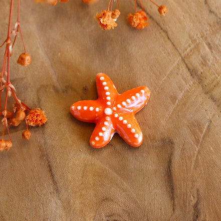 Bead orange - ceramic starfish