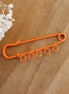 Decorative pin - orange