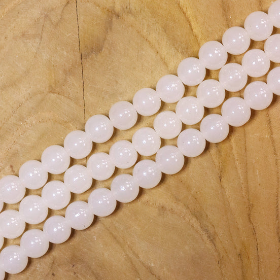 Gekleurde glaskralen per streng - crème