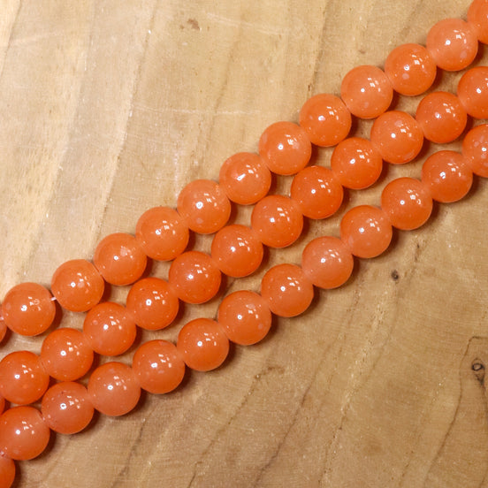 Gekleurde glaskralen per streng - oranje