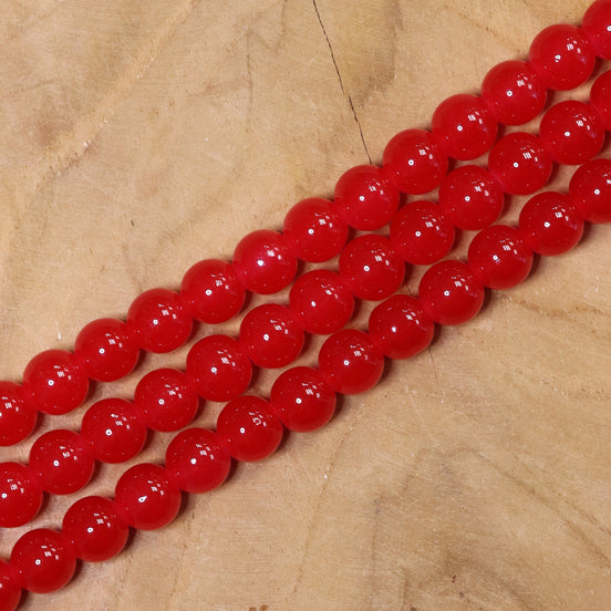 Gekleurde glaskralen per streng - rood