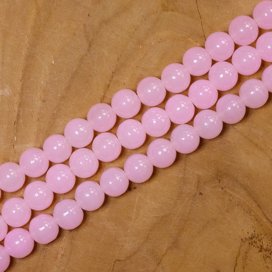 Gekleurde glaskralen per streng - lichtroze
