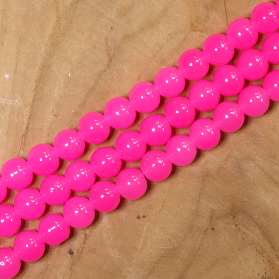 Gekleurde glaskralen per streng - fuchsia