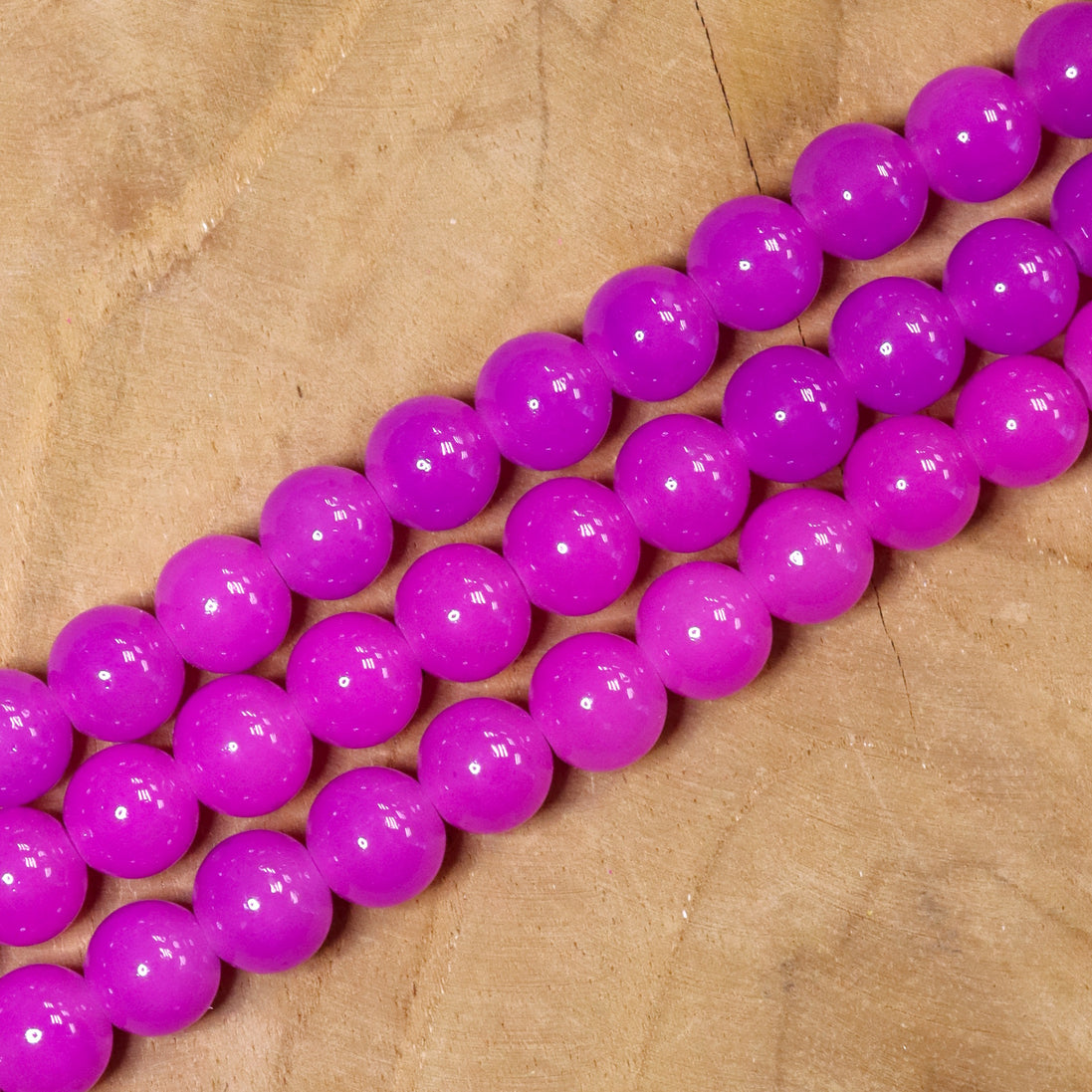 Gekleurde glaskralen per streng - paars