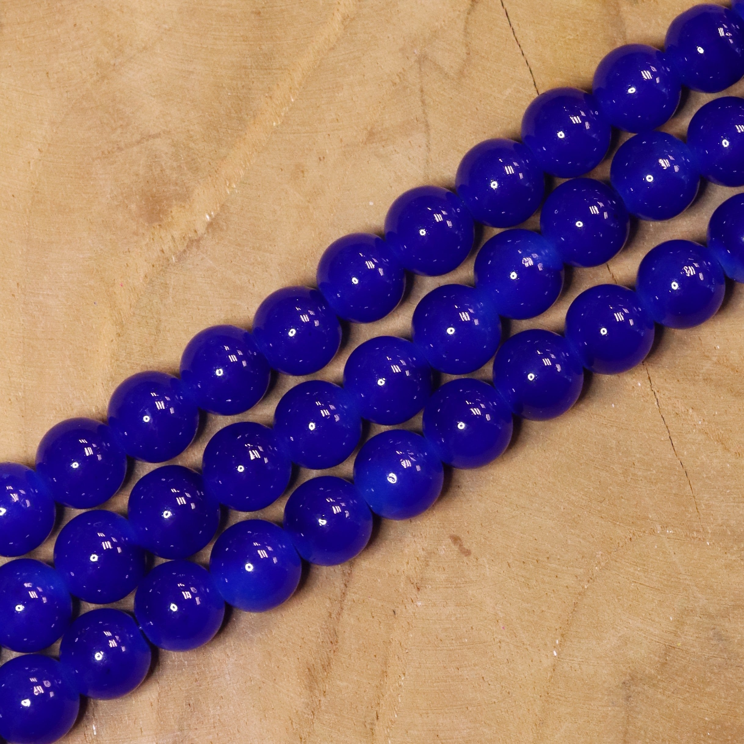 Gekleurde glaskralen per streng - donkerblauw