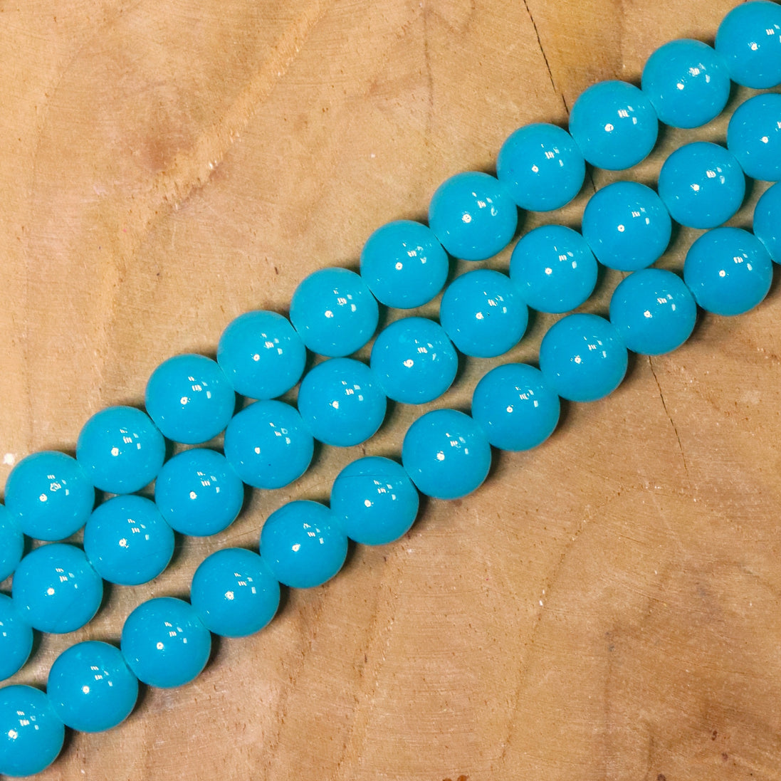 Gekleurde glaskralen per streng - turquoise