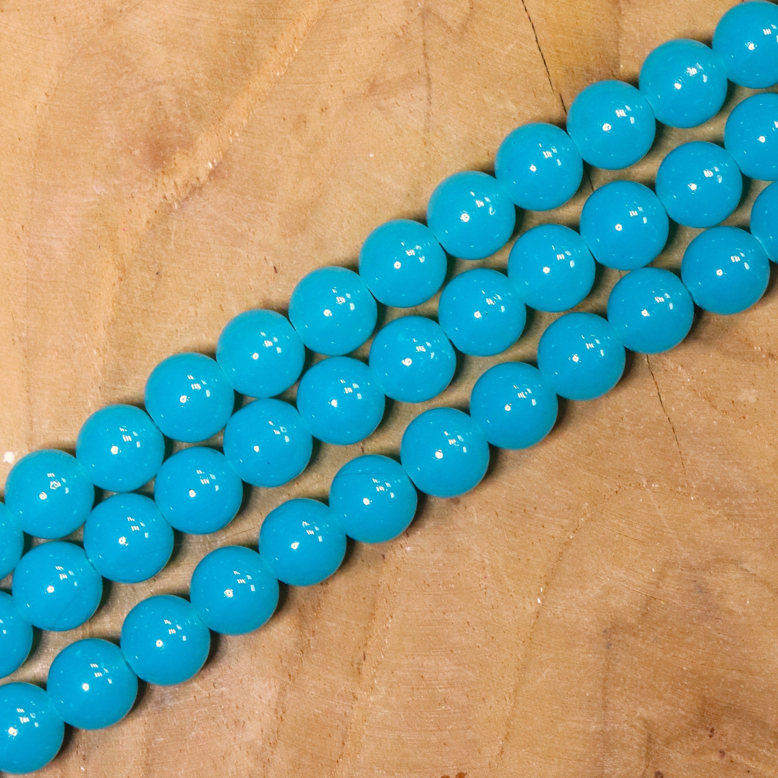 Gekleurde glaskralen per streng - turquoise