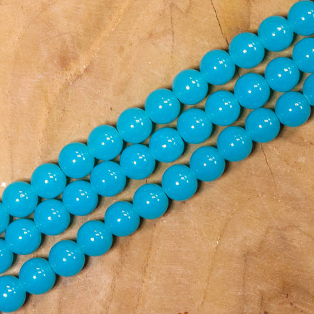 Gekleurde glaskralen per streng - turquoise