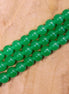 Colored glass beads per strand - green