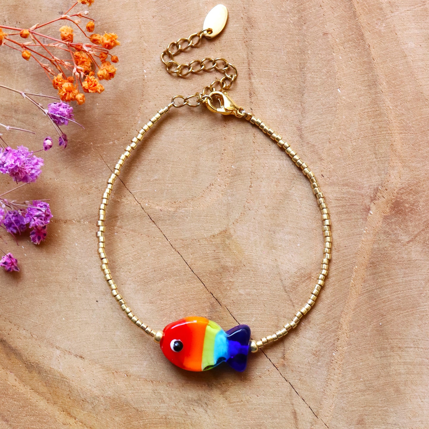 Beaded bracelet - gold with rainbow fish