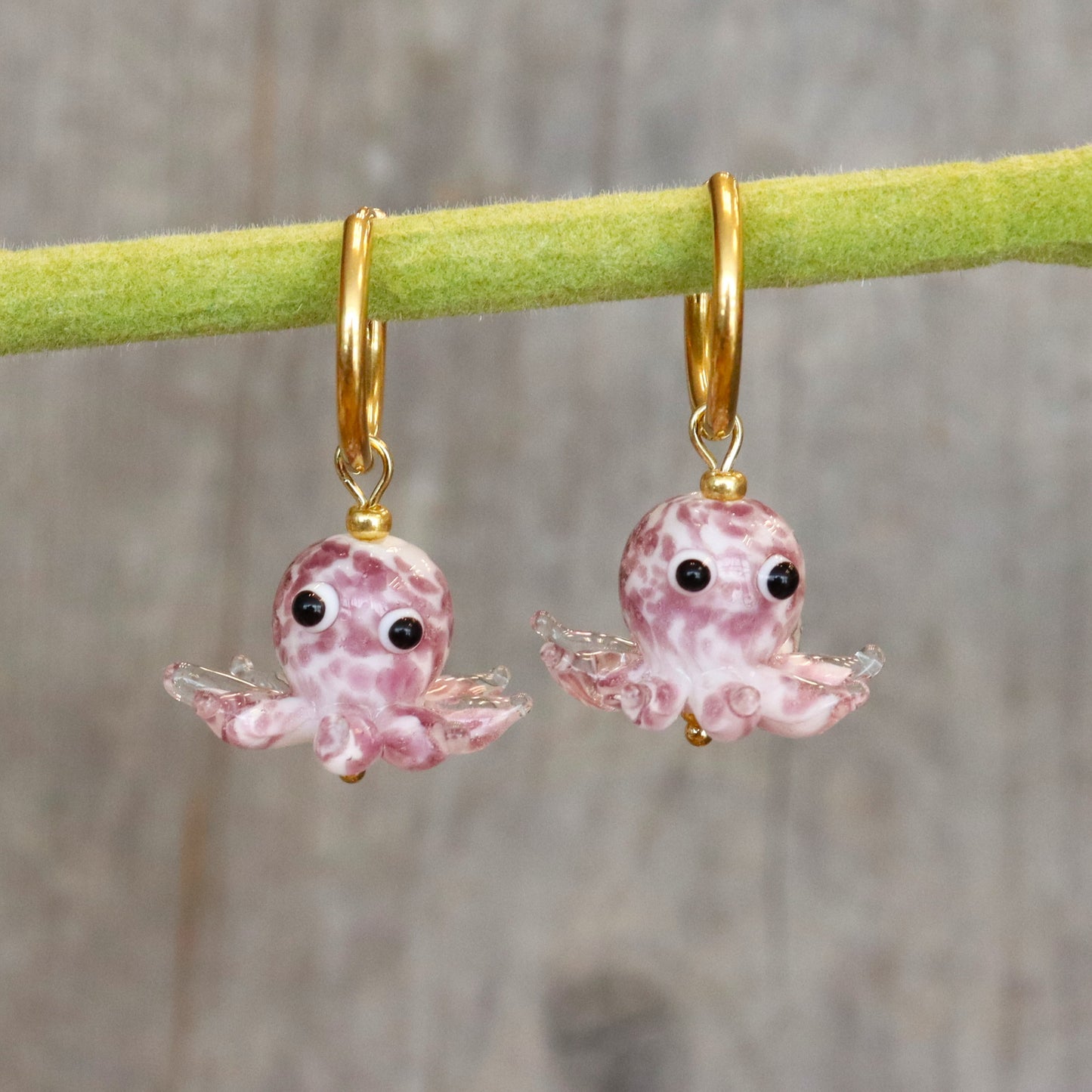 Stainless steel earrings with a little squid.