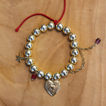 Kralenarmband - goud met bedels en jasseron